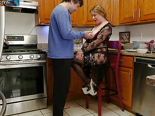 Stepmom enticing stepson's cock surrounding the kitchen for breakfast